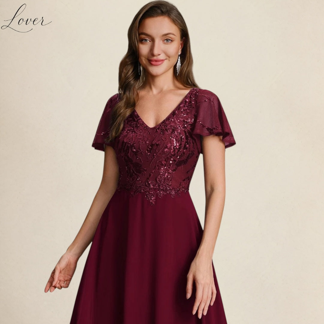 Vestido vino de encaje y lentejuelas con manga