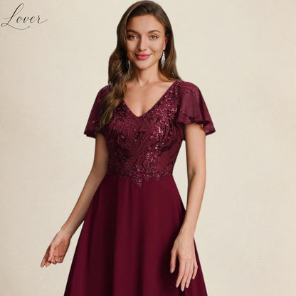 Vestido vino de encaje y lentejuelas con manga