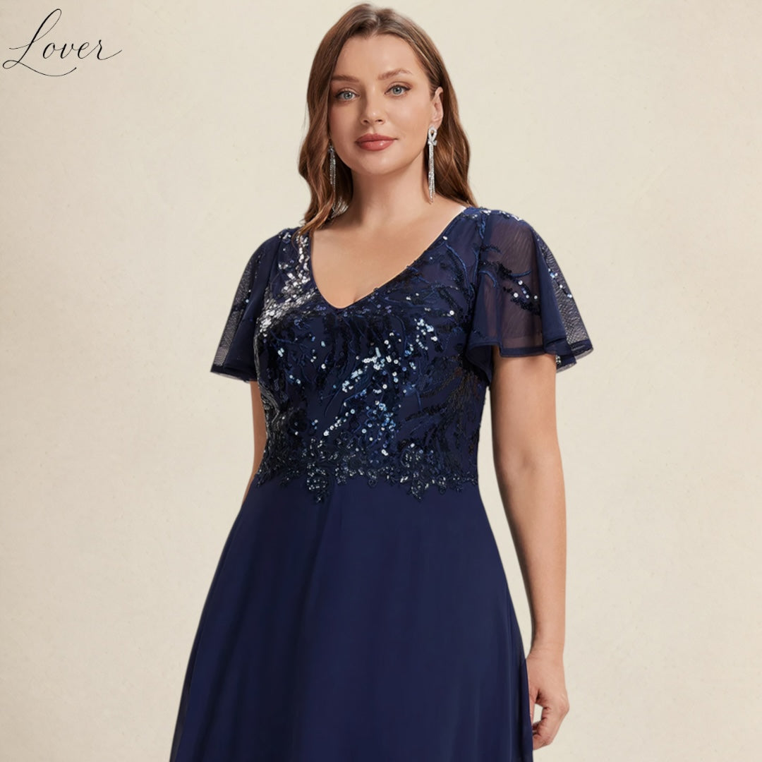 Vestido azul navy de encaje y lentejuelas con manga