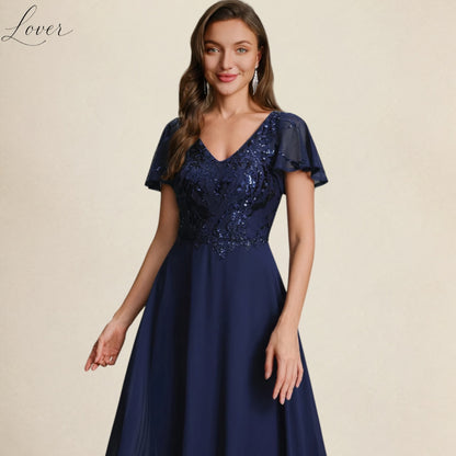 Vestido azul navy de encaje y lentejuelas con manga