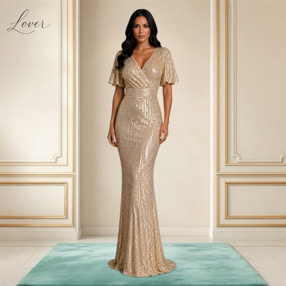 Vestido dorado al cuerpo de lentejuelas