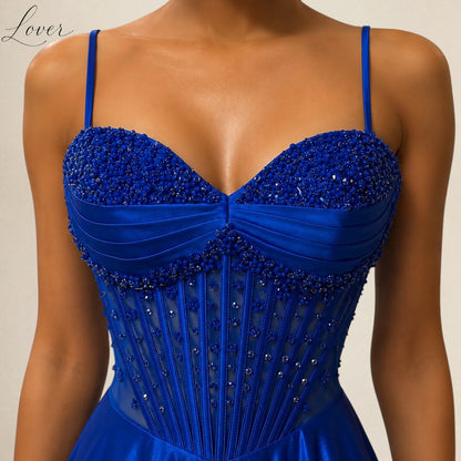 Vestido azul al cuerpo con flores en top