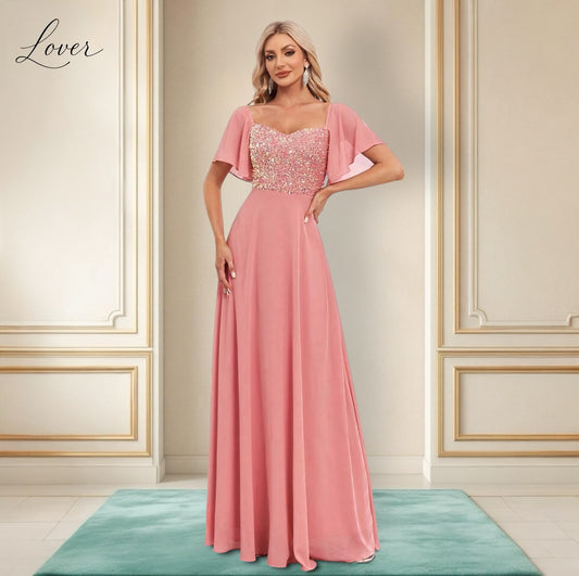 Vestido coral con detalles en top y manga