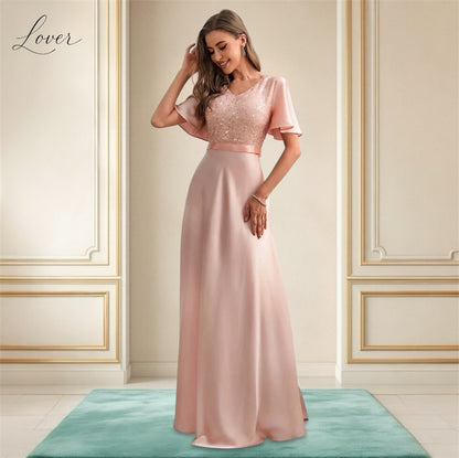 Vestido blush con lentejuelas en top