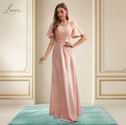 Vestido blush con lentejuelas en top