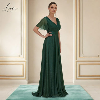 Vestido verde esmeralda con brillos de manga corta