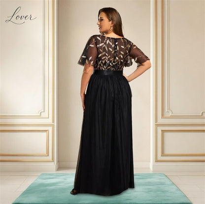 Vestido negro con detalles en dorado