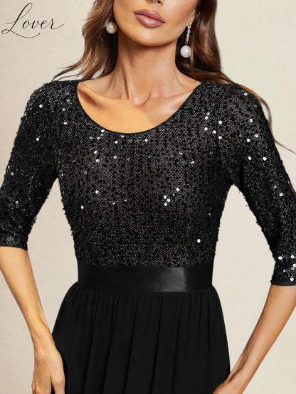Vestido negro de manga larga con lentejuelas