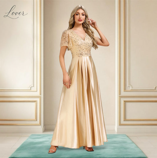 Vestido midi dorado con lentejuelas en top