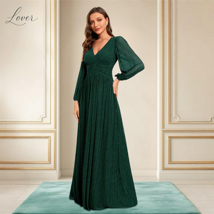 Vestido verde esmeralda de manga larga con brillos