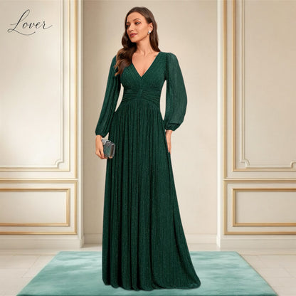 Vestido verde esmeralda de manga larga con brillos