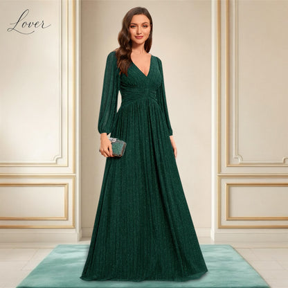 Vestido verde esmeralda de manga larga con brillos